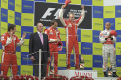 Kimi enjoys his victory - next to the Spanish King