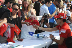 Giancarlo signs autographs