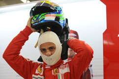 Felipe puts his helmet on