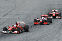 Button in the Ferrari sandwich